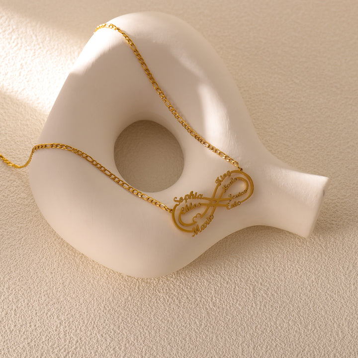 1-8 name necklace in rose gold presented in a gift box with family photo
