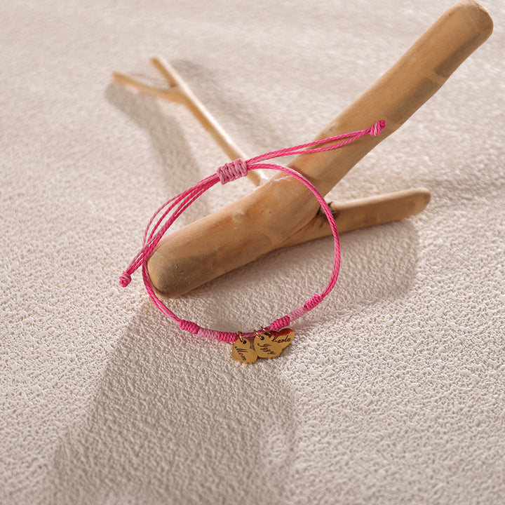 Close-up of adjustable woven bracelet with engraved name – artisanal jewelry