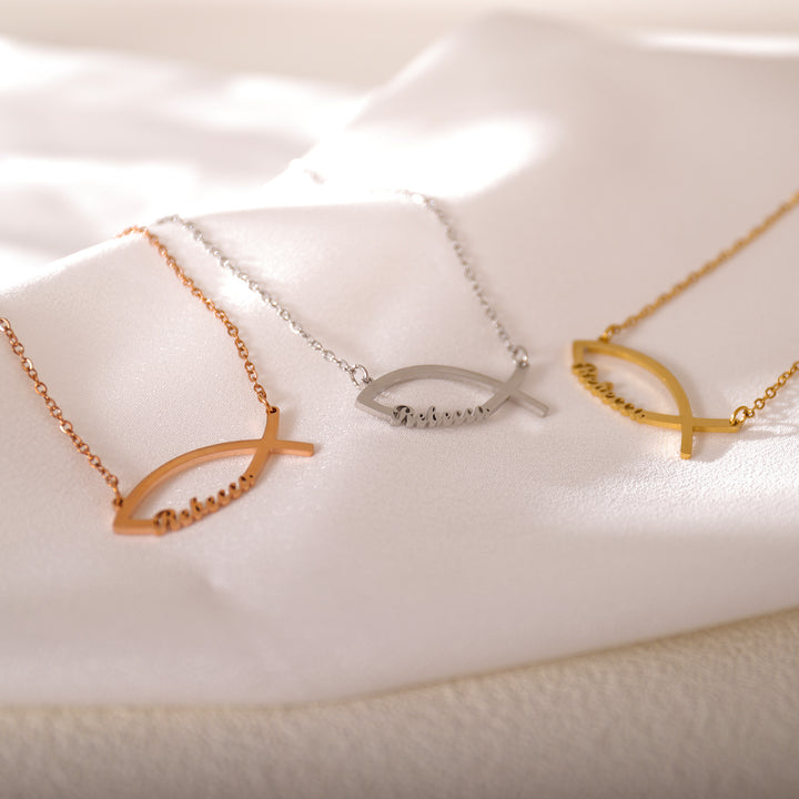 Close-up of custom name inside fish pendant – symbolic and elegant