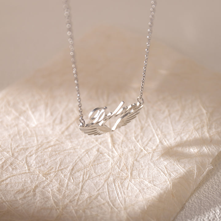 Close-up of custom name with angel wings – meaningful and elegant design