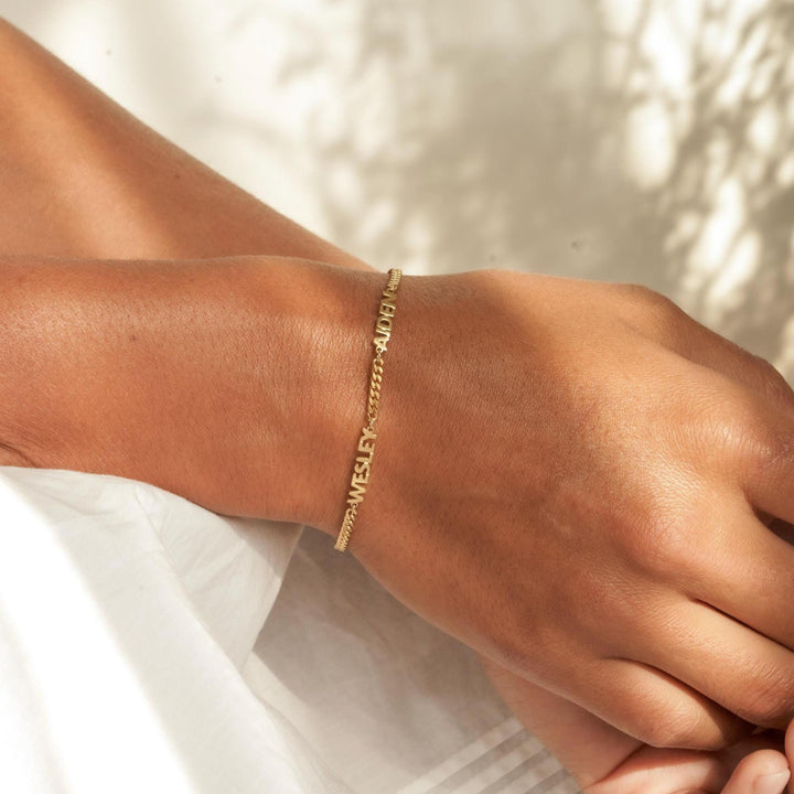 Close-up of handcrafted name bracelet – unique multi-name design