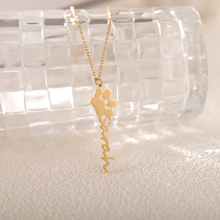 Close-up of paw print charm with custom name engraving – tribute to beloved pet