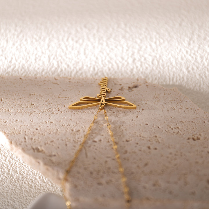 Close-up of silver dragonfly name necklace with custom engraving – perfect gift