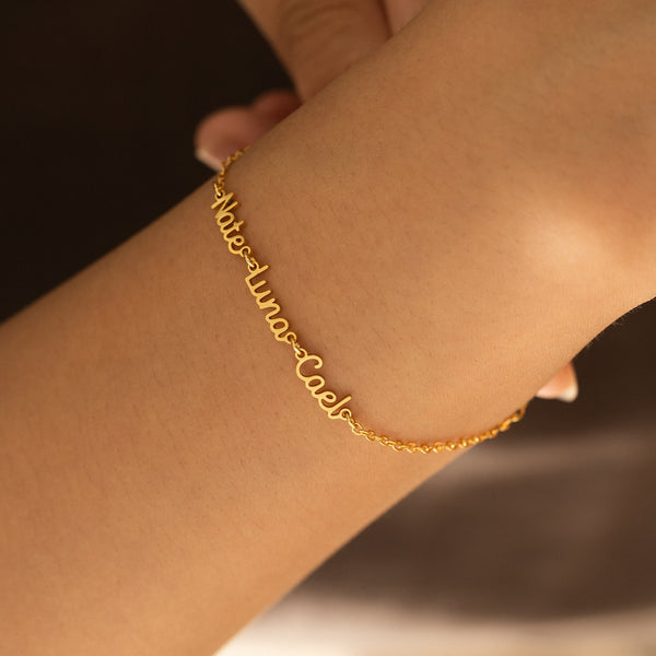 Gold family name bracelet with three engraved names – custom LUNA jewelry