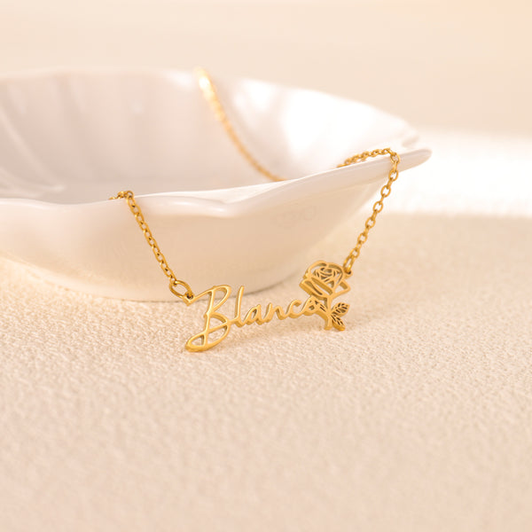 Gold flower pendant necklace with engraved name on petal charm