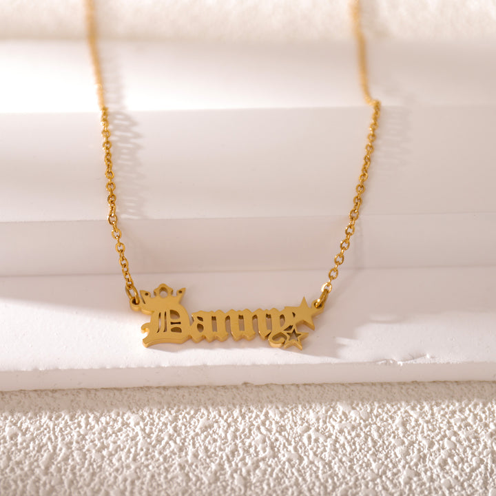Gold old letter pendant necklace close-up – elegant vintage design by LUNA