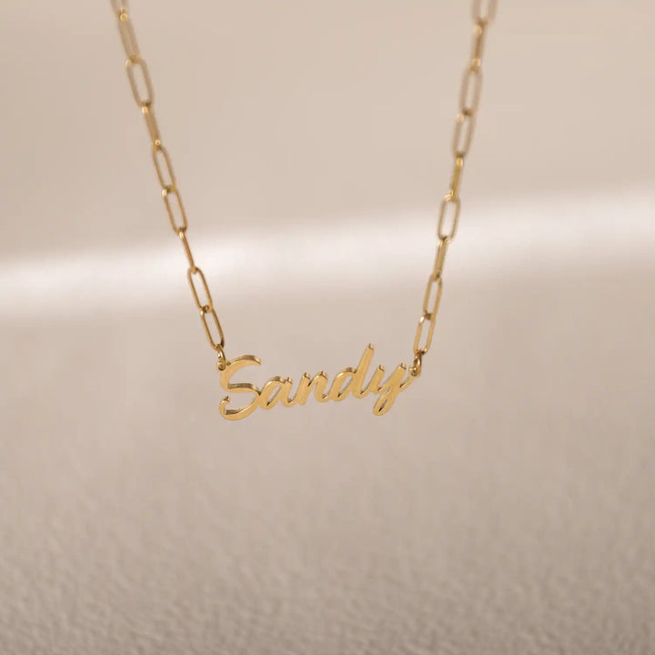 Gold paperclip chain necklace with personalized name charm – bold and elegant