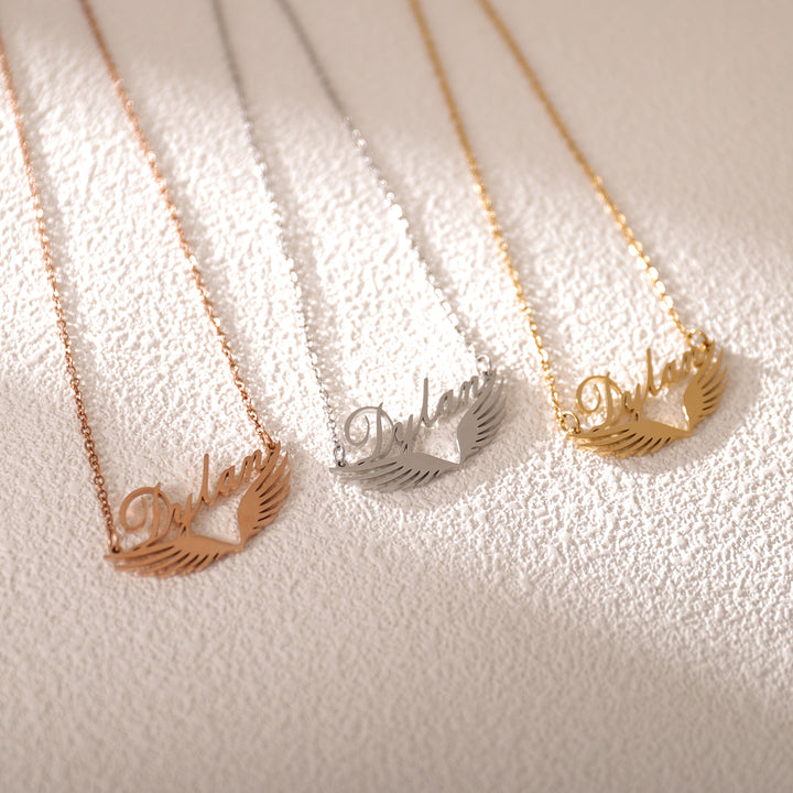 Model wearing winged name necklace – stylish spiritual accessory