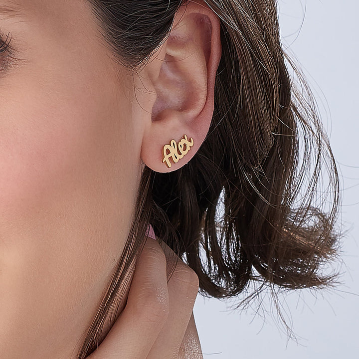 Personalized arc earrings in gift box with soft fabric background