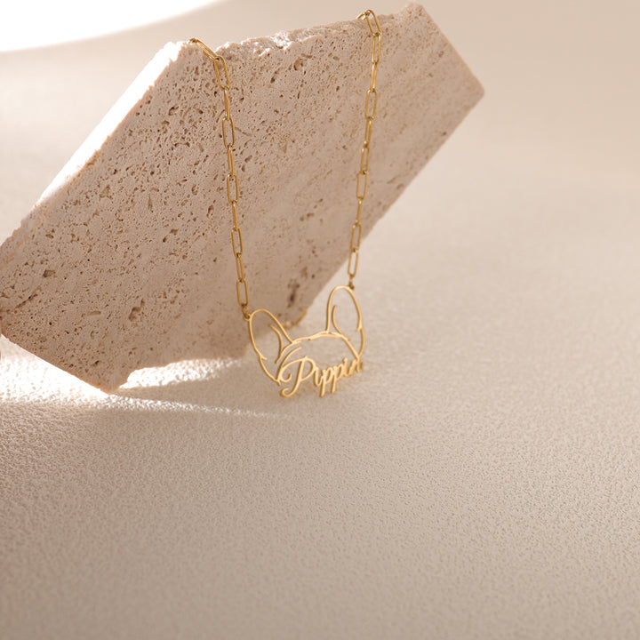 Personalized dog necklace shown next to photo of golden retriever