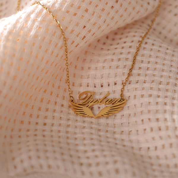 Personalized winged name necklace in gold – angel wings charm jewelry