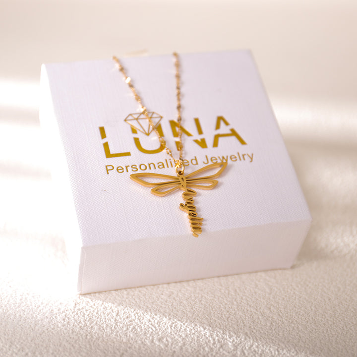 Rose gold dragonfly name necklace worn on model – feminine and stylish design