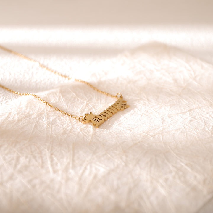 Rose gold old letter necklace worn on model – personalized vintage accessory